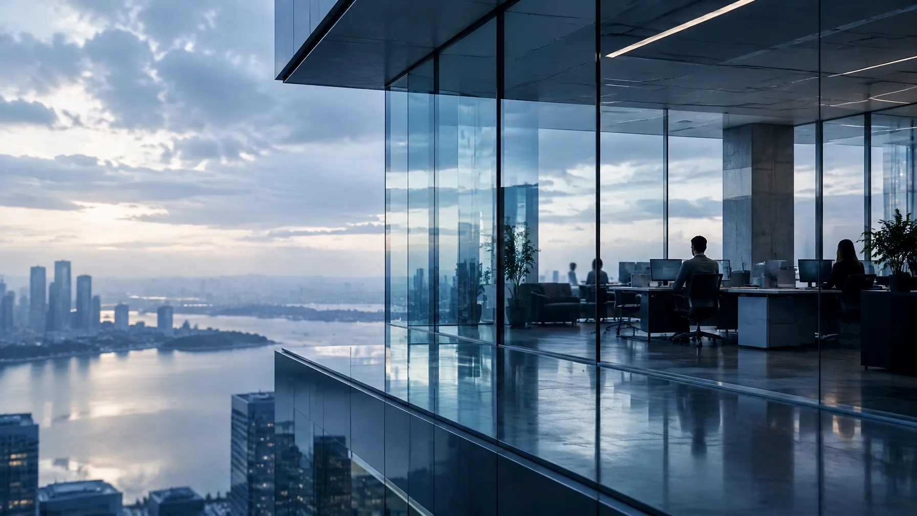 Service operations team working in a glass-walled office overlooking the city